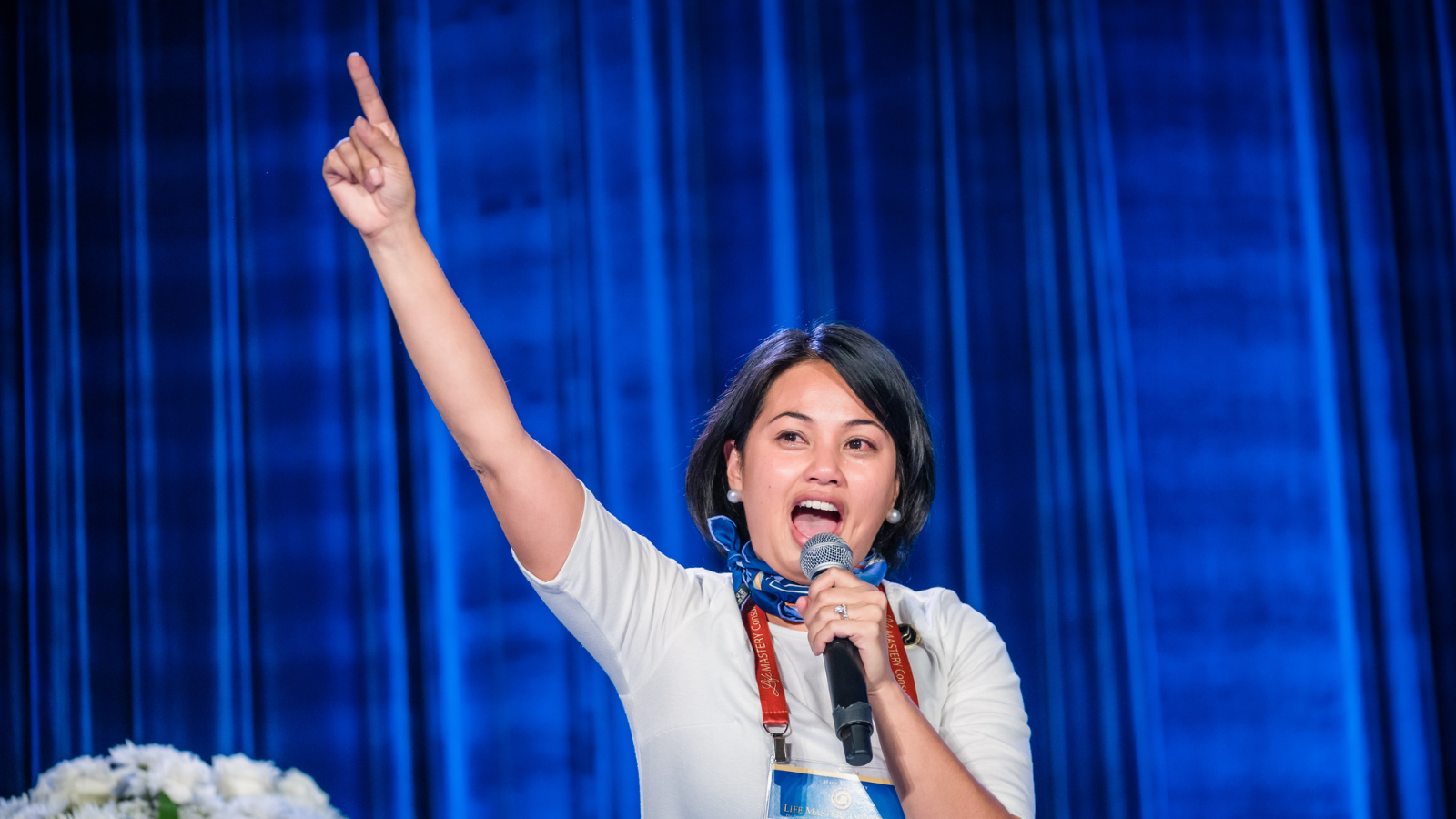 Diana Bejasa delivering a motivational keynote in Hawaii, inspiring leaders to fuel success without burnout.