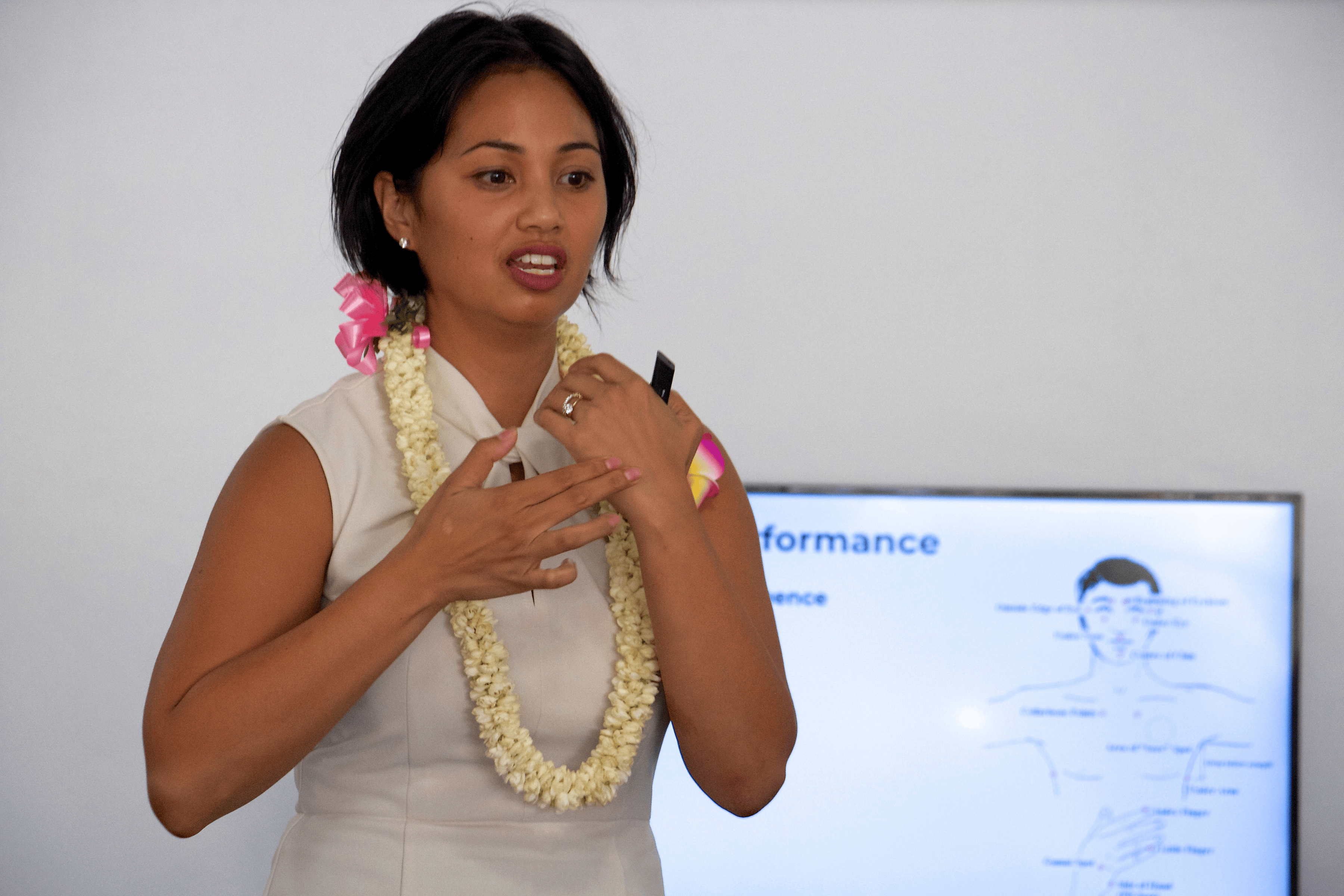Diana Bejasa demonstrating a Thought Field Therapy tapping sequence during a live workshop in Honolulu, Hawaii.